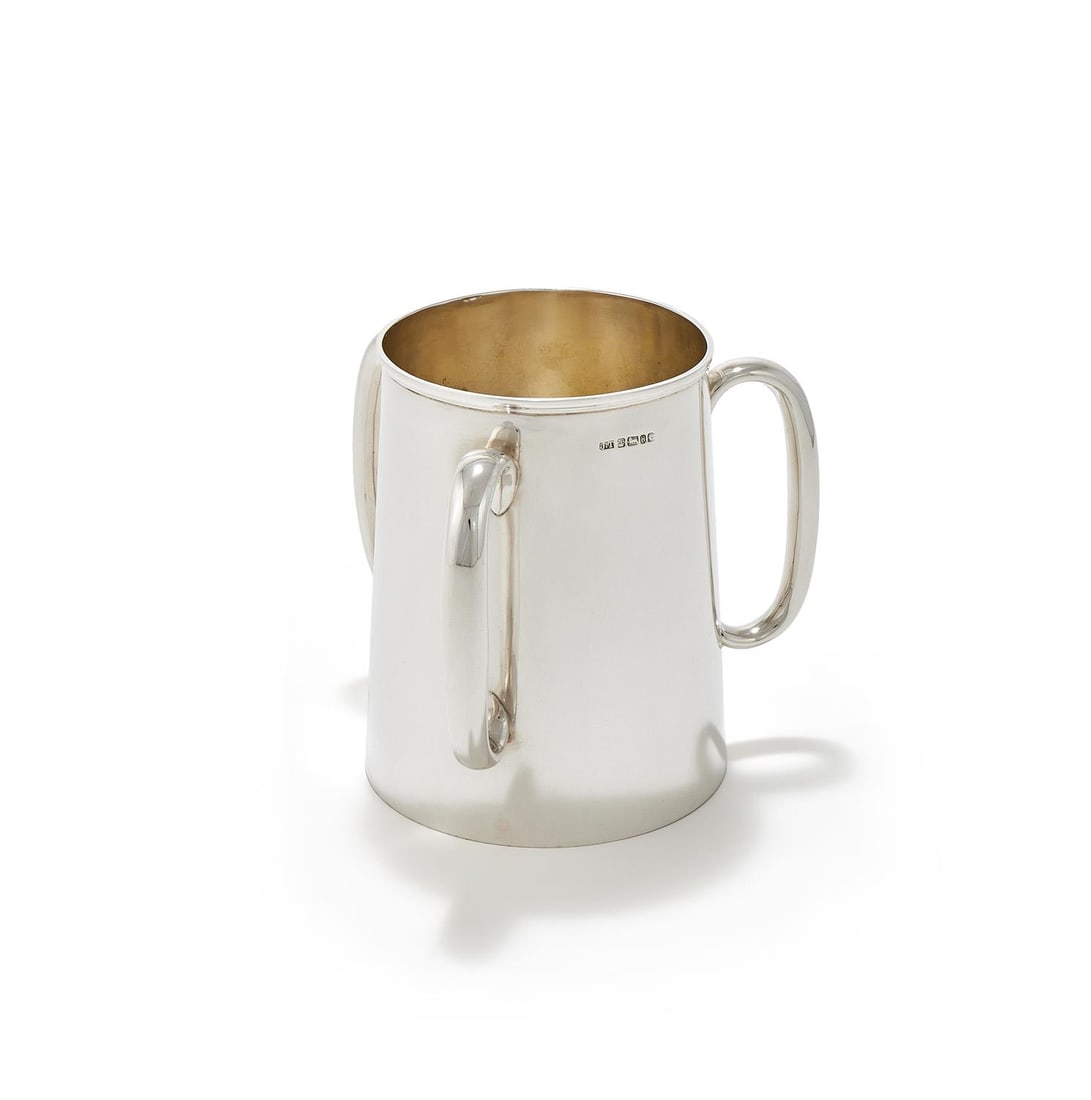 A VICTORIAN SILVER THREE HANDLED CUP/VASEJAMES THOMPSON: A VICTORIAN SILVER THREE HANDLED CUP/VASEJAMES THOMPSON, SHEFFIELD 1875 The slightly tapering body with three loop handles18cm high866g (27.85 oz) Provenance:An Anglo-French Collection Of Silver