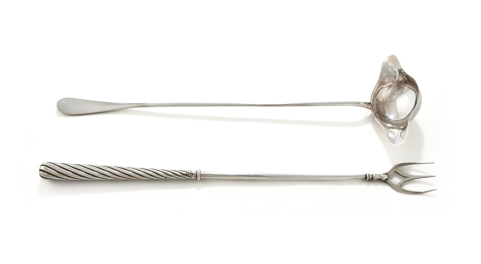 A VICTORIAN SILVER TOASTING FORK AND A FRENCH SILVER TODDY LADLE: A VICTORIAN SILVER TOASTING FORKEDWARD HUTTON & SONS, LONDON 1888With a wrythen handle41.5cm longLoaded Together with:A FRENCH SILVER TODDY LADLE .925 STANDARD MINERVA MARKEngraved with an armorial wi