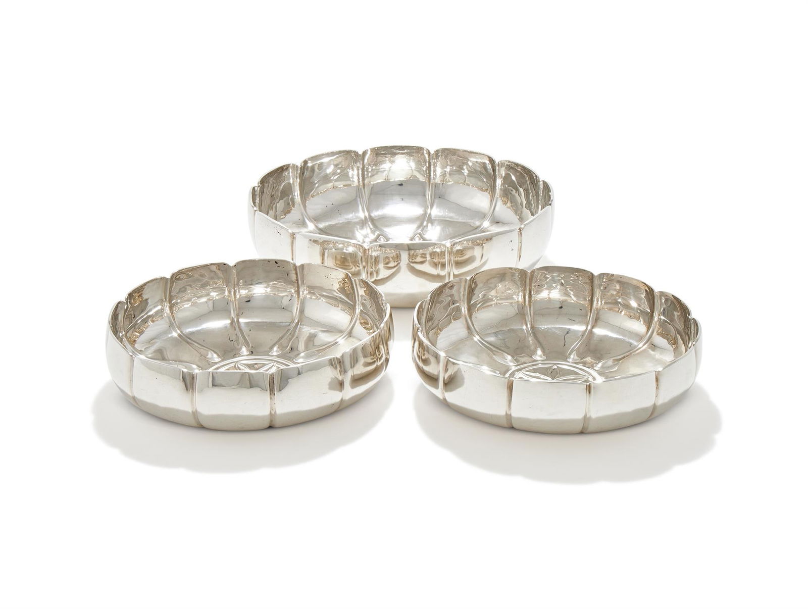 A SET OF THREE SILVER SHAPED CIRCULAR BOWLS (1 of 3)