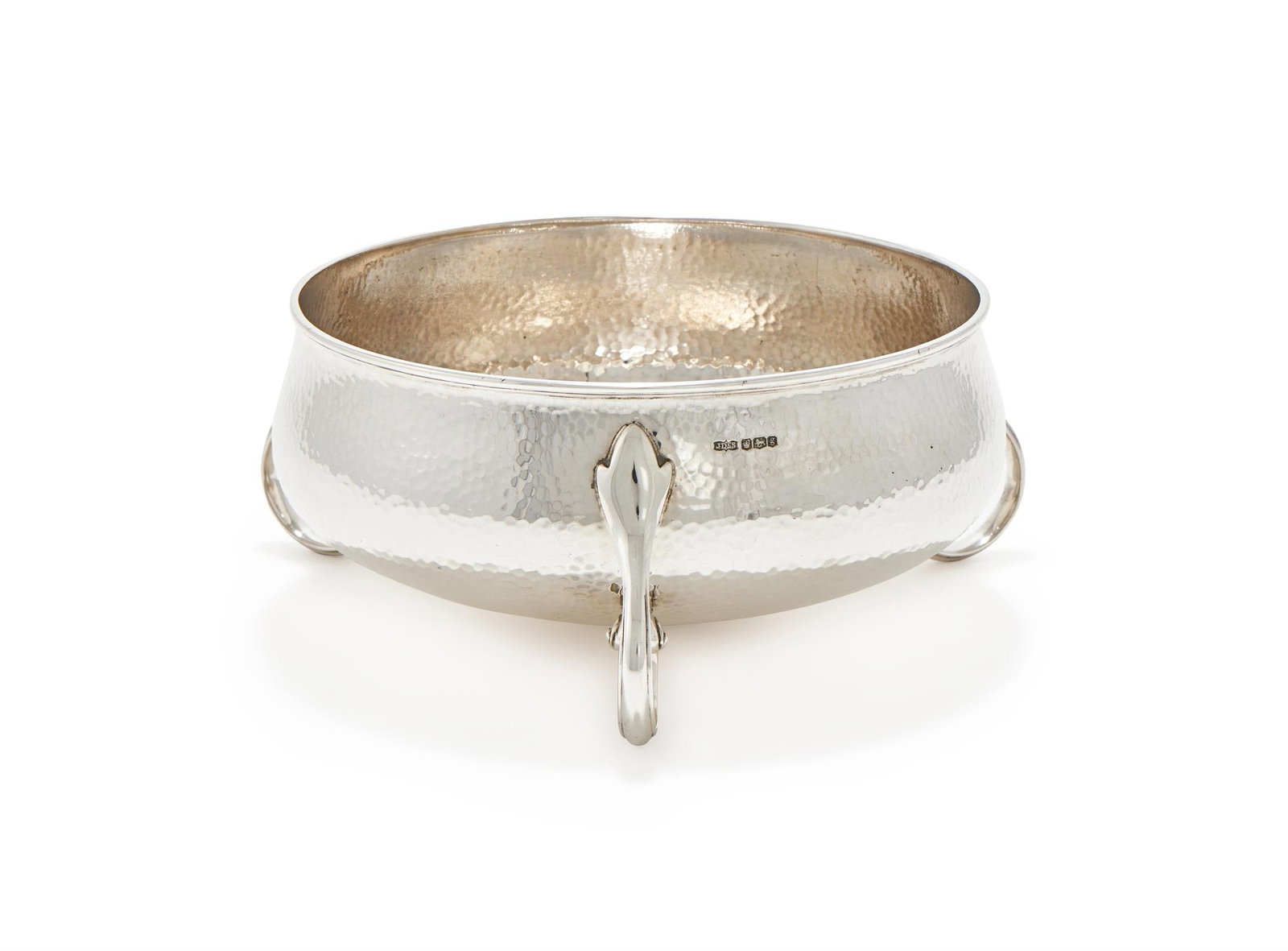 A SILVER HAMMERED BOWL: A SILVER HAMMERED BOWLJAMES DIXON & SONS, SHEFFIELD 1924On three scroll feet18.5cm diameter665g (21.4 oz) Provenance:An Anglo-French Collection Of Silver