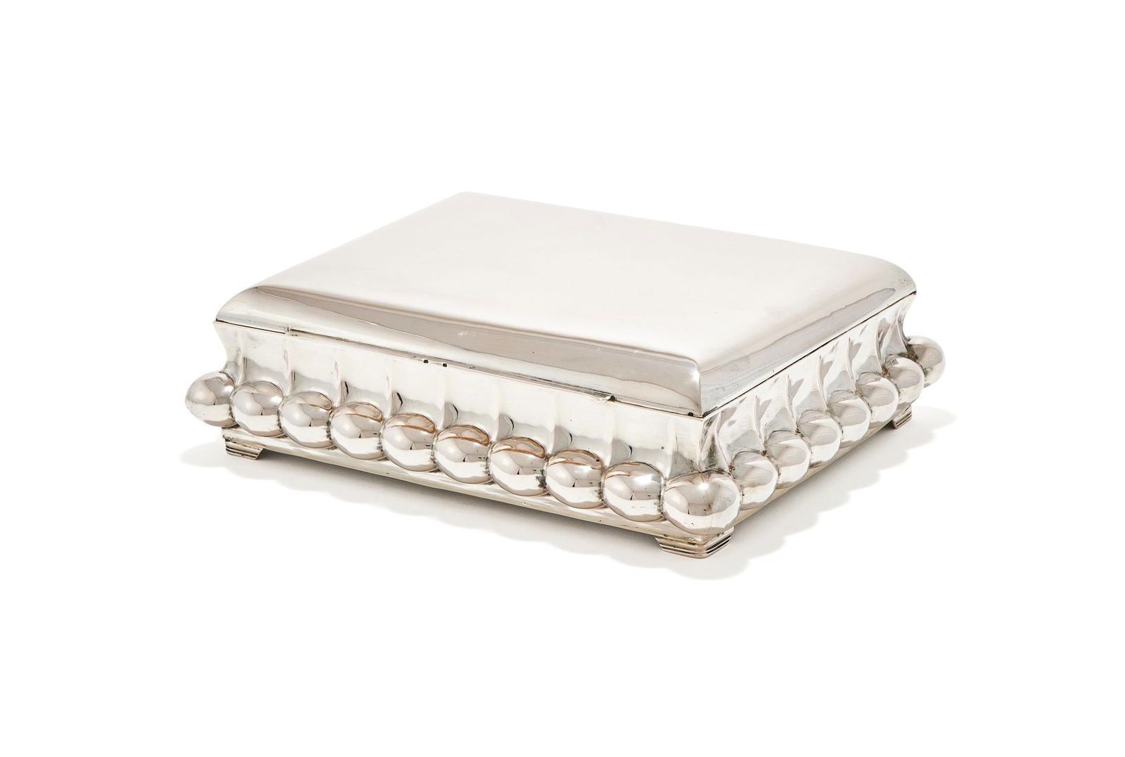 A HUNGARIAN SILVER RECTANGULAR BOX: A HUNGARIAN SILVER RECTANGULAR BOX1937 - 1966 .800 STANDARDWith a lobed band and four bracket feet29cm longWith a wood interior Provenance:An Anglo-French Collection Of Silver