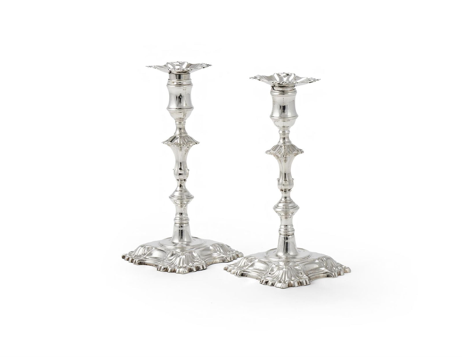 A PAIR OF GEORGE II CAST SILVER CANDLESTICKS (1 of 3)