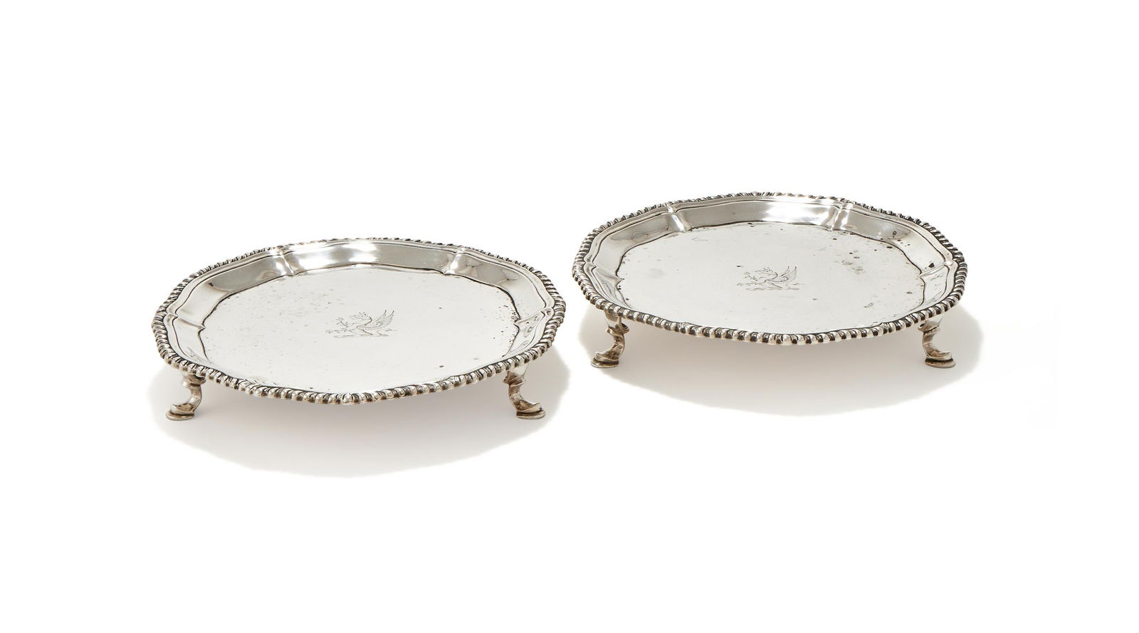 A PAIR OF GEORGE III SILVER SHAPED CIRCULAR WAITERS (1 of 3)