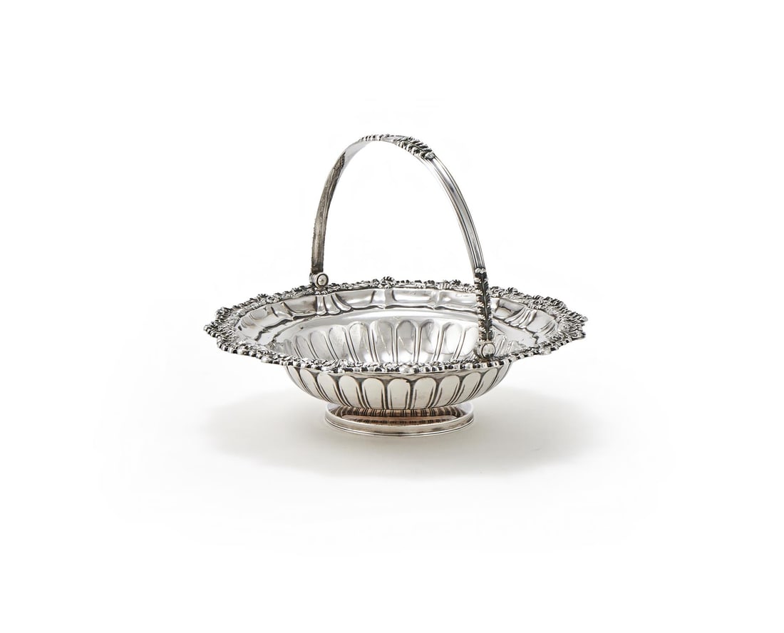 A GEORGE IV SILVER SHAPED CIRCULAR SWING HANDLED BASKET (1 of 3)