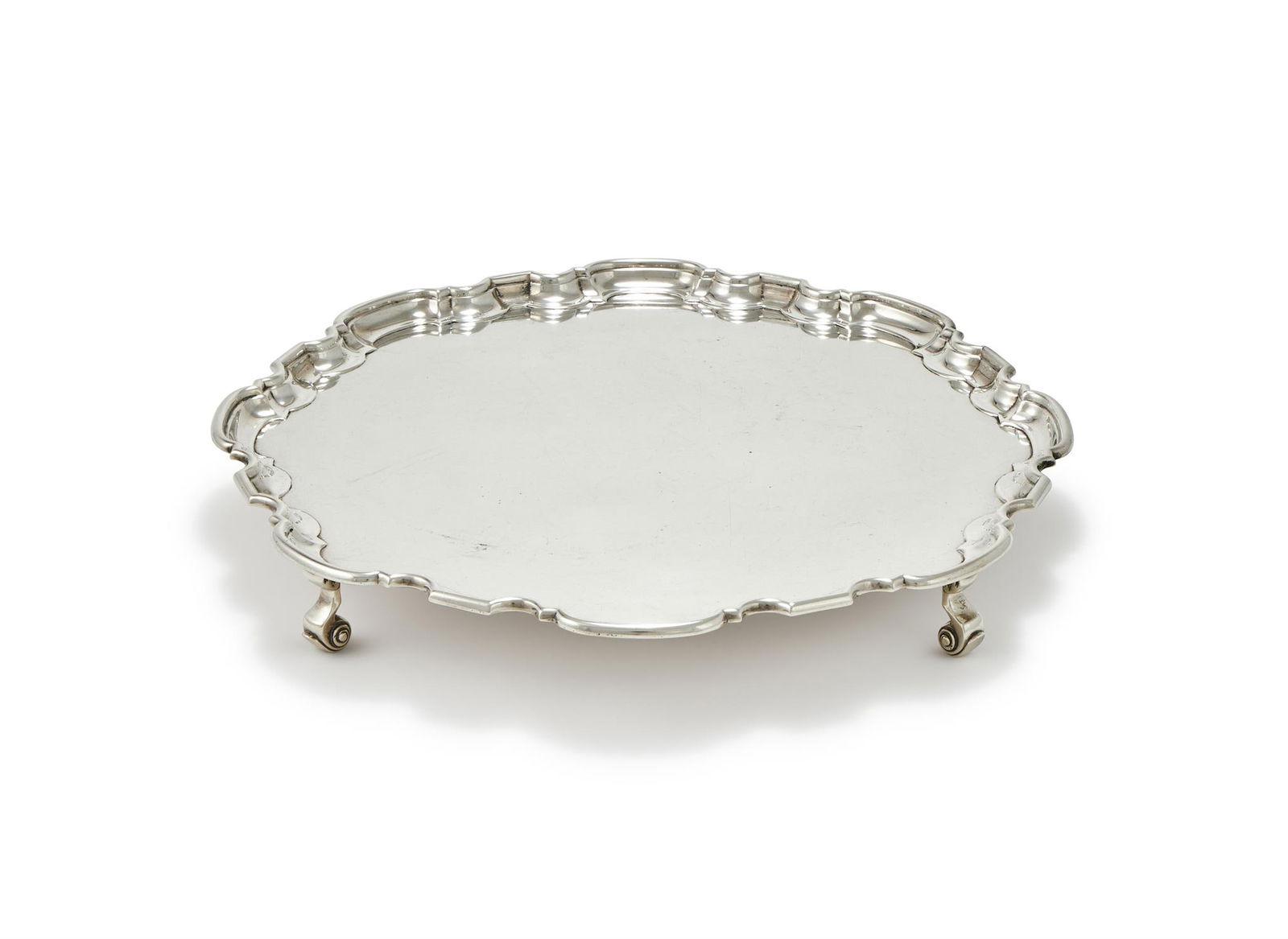 A SILVER SHAPED CIRCULAR SALVER (1 of 2)