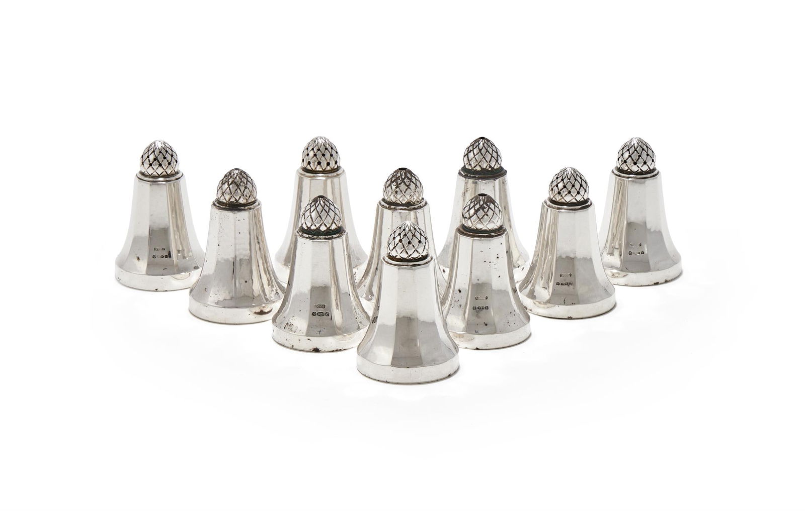 A SET OF TEN DANISH SILVER ACORN PATTERN SALT AND PEPPER SHAKERS: A SET OF TEN DANISH SILVER ACORN PATTERN SALT AND PEPPER SHAKERSGEORG JENSEN, DESIGN NO. 423B, LONDON IMPORT MARKSWith flared bodies4.5cm high201g (6.45 oz)