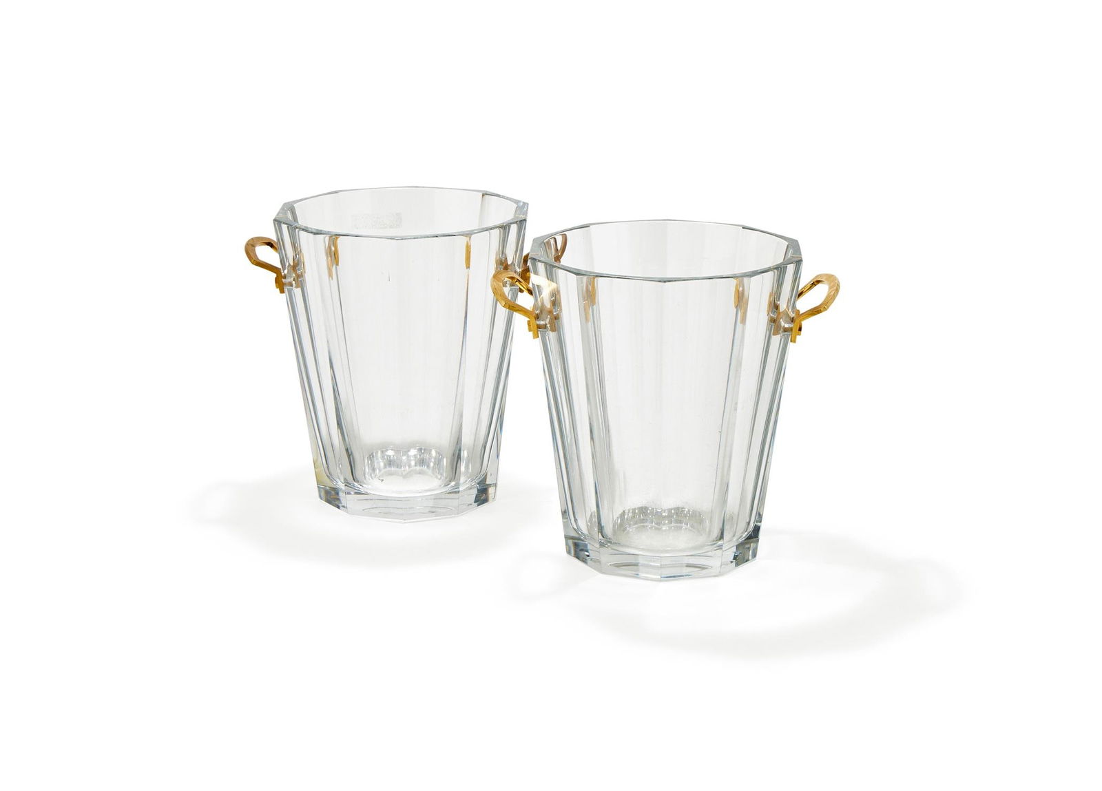 BACCARAT, MAXIM, A PAIR OF CLEAR GLASS CHAMPAGNE/ICE PAILS: BACCARAT, MAXIM, A PAIR OF CLEAR GLASS CHAMPAGNE/ICE PAILSLORRAINE, FRANCE, MODERNOf tapered form with shaped gilded carrying handles, etched Baccarat France to the base23.1cm high