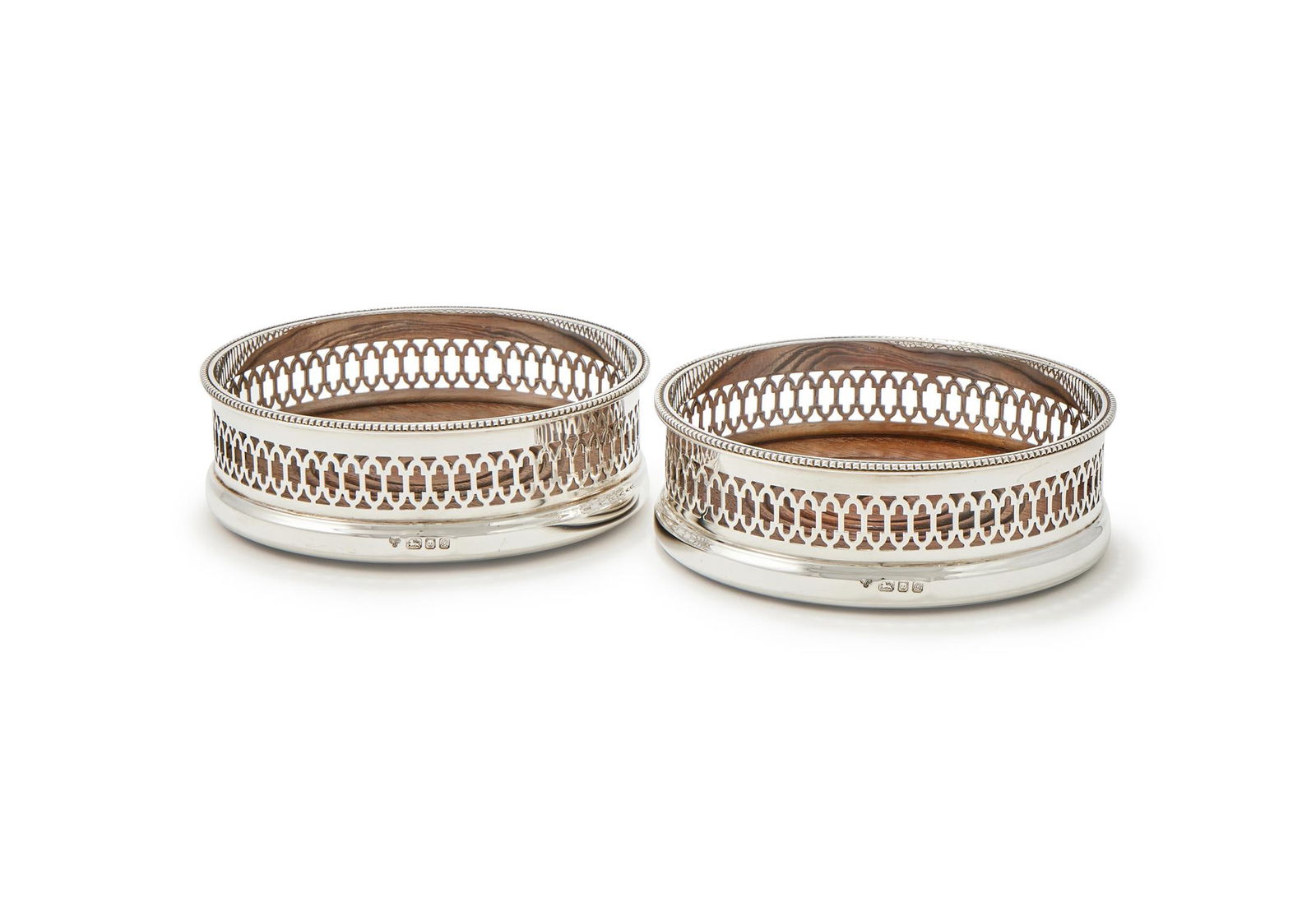 A PAIR OF SILVER MOUNTED BOTTLE COASTERS (1 of 3)