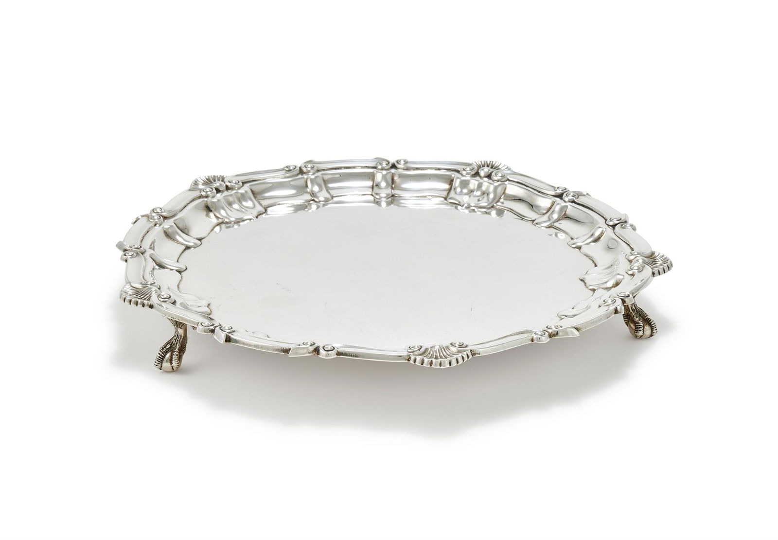 A SILVER SHAPED CIRCULAR SALVER (1 of 2)