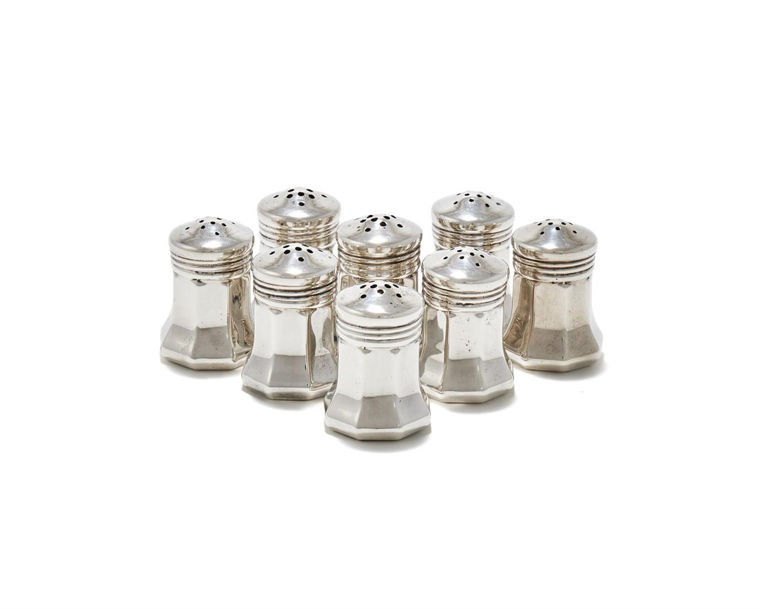 CARTIER, A CASED SET OF EIGHT AMERICAN SILVER SALT AND PEPPER SHAKERS: CARTIER, A CASED SET OF EIGHT AMERICAN SILVER SALT AND PEPPER SHAKERSSTAMPED STERLINGWith pierced domed cover and flared bodies4cm high68g (2.2 oz)