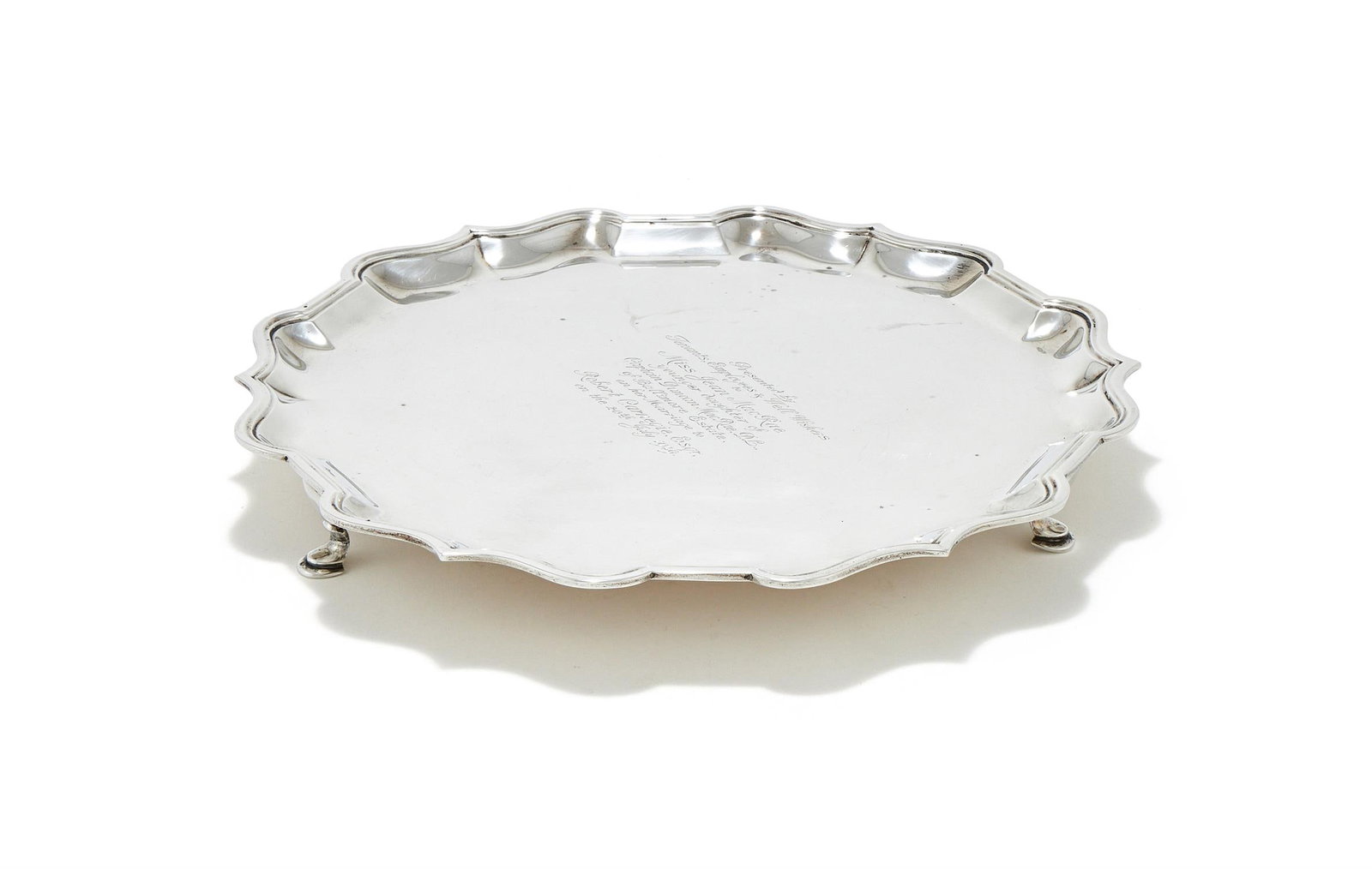 A SILVER SHAPED CIRCULAR SALVER (1 of 4)