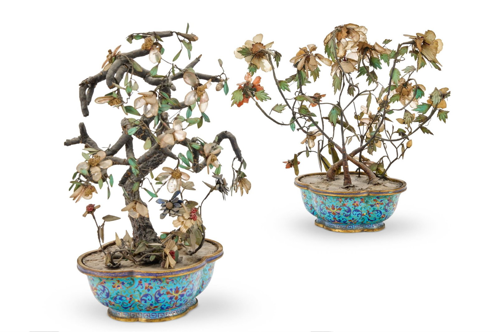 A PAIR OF ENAMEL AND HARDSTONE JARDINIERES ISSUING MODELS OF FLOWERING SHRUBS, CANTONESE (1 of 2)