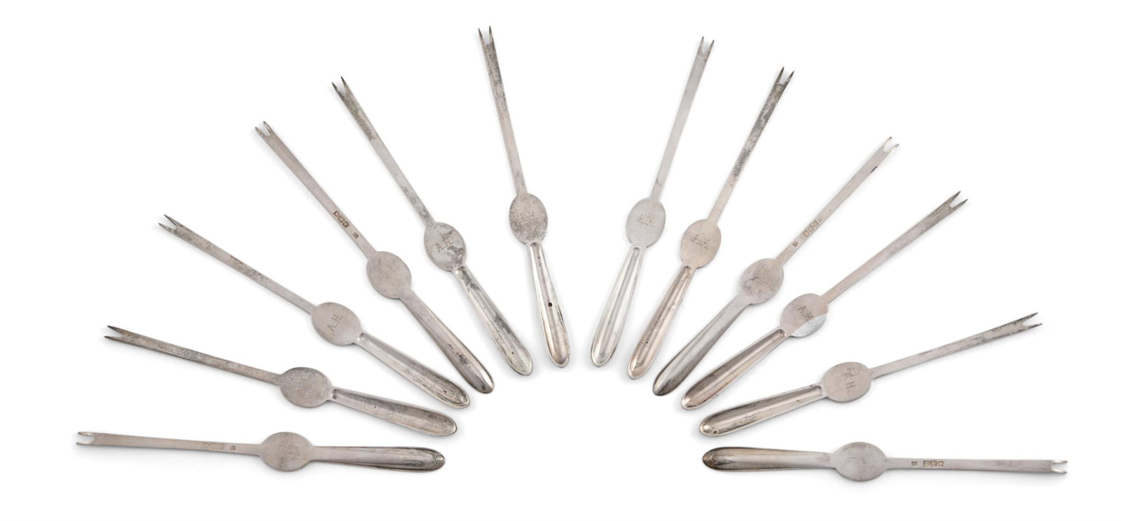 A VICTORIAN SET OF TWELVE SILVER LOBESTER PICKS: A VICTORIAN SET OF TWELVE SILVER LOBESTER PICKSHOLLAND, ALDWINCKLE & SLATER (THOMAS ALFRED SLATER, WALTER BRINDSLEY SLATER & HENRY ARTHUR HOLLAND), LONDON 1898Engraved A.H.20cm long523g (16.8 oz)