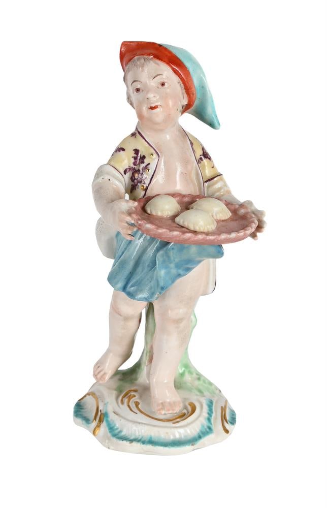 A DERBY PORCELAIN MODEL OF A CHILD PASTRY SELLER, CIRCA 1765: A DERBY PORCELAIN MODEL OF A CHILD PASTRY SELLER