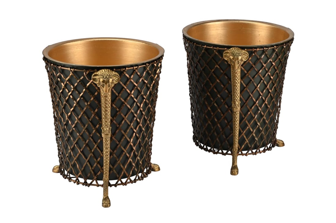 A PAIR OF GILT AND PATINATED WASTE PAPER BASKETS, MODERN: A PAIR OF GILT AND PATINATED WASTE PAPER BASKETS MODERN Each with liner with grille frame, ram head masks each 29.5cm high, 25cm diameter Condition Report: 
