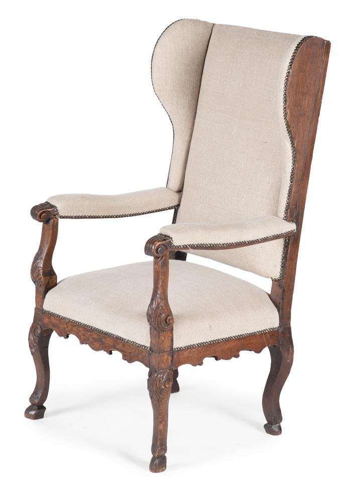 AN OAK AND UPHOLSTERED WINGBACK OPEN ARMCHAIR, PROBABLY DUTCH, 1750 AND LATER (1 of 3)
