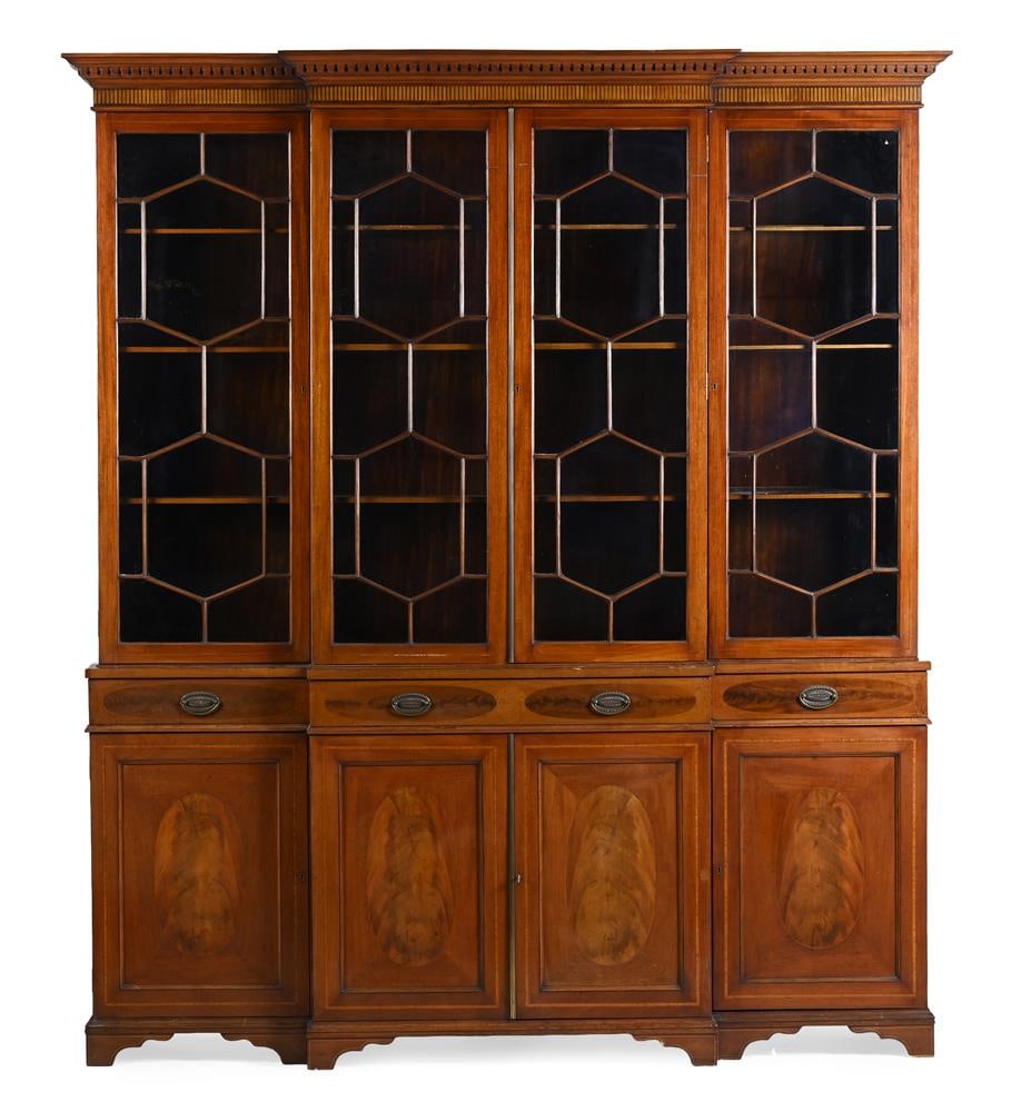 Y AN EDWARDIAN MAHOGANY, SATINWOOD AND EBONY STRUNG BREAKFRONT BOOKCASE, EARLY 20TH CENTURY AND LATE: Y AN EDWARDIAN MAHOGANY, SATINWOOD AND EBONY STRUNG BREAKFRONT BOOKCASE SCOTTISH, EARLY 20TH CENTURY AND LATER One drawer bearing the trade stamp for W&C NORRIE & SON,