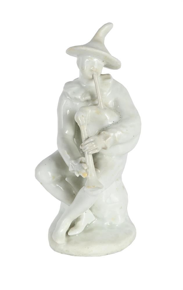 A BOW WHITE PORCELAIN FIGURE OF A HARLEQUIN FROM THE COMMEDIA DELL'ARTE, CIRCA 1752: A BOW WHITE PORCELAIN FIGURE OF A HARLEQUIN FROM THE COMMEDIA DELL'ARTE CIRCA 1752 Modelled seated playing the bagpipes 15cm high, 5cm at base Note A similar example in