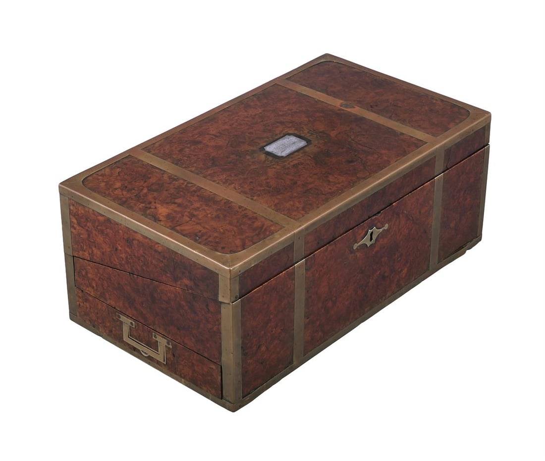 Y A CHINESE EXPORT, BRASS BOUND AMBOYNA CAMPAIGN WRITING BOX, MID 19TH CENTURY: Y A CHINESE EXPORT, BRASS BOUND AMBOYNA CAMPAIGN WRITING BOX MID 19TH CENTURY The ebony interior, fitted three secret drawers, the top with silver plaque to the centre inscribed 'From the