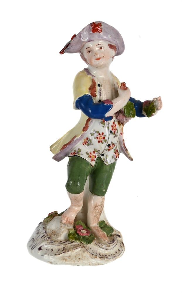 A BOW PORCELAIN MODEL OF A BOY EMBLEMATIC OF AUTUMN FROM A SERIES OF THE FOUR SEASONS, CIRCA 1765: A BOW PORCELAIN MODEL OF A BOY EMBLEMATIC OF AUTUMN FROM A SERIES OF THE FOUR SEASONS CIRCA 1765 14.5cm high, 6cm at base Condition Report: PLEASE NOTE: ALL LOTS ARE