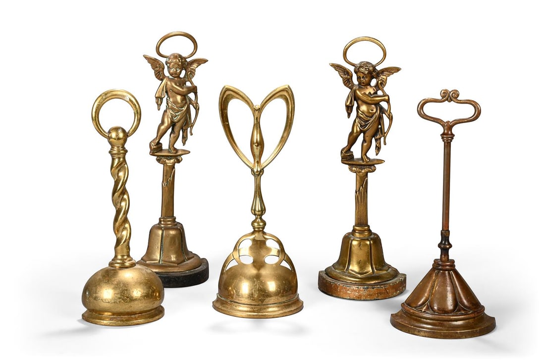 A GROUP OF FIVE BRASS DOOR PORTERS OR DOOR STOPS, LATE 19TH AND 20TH CENTURY (1 of 3)