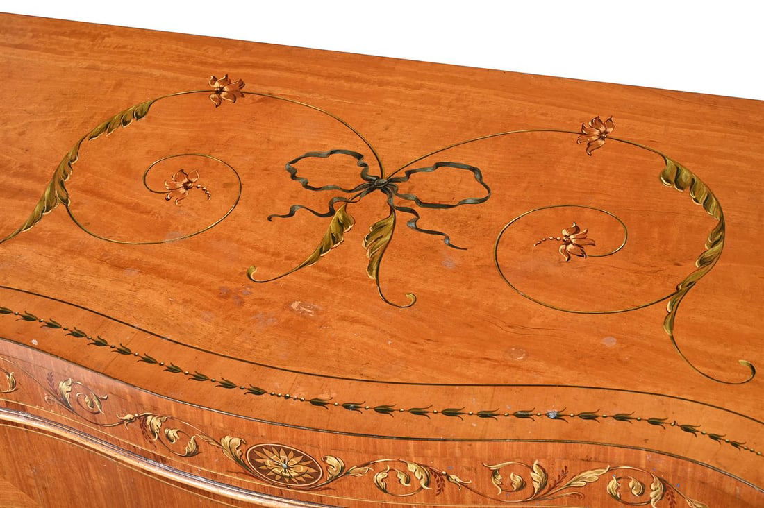 Y AN EDWARDIAN SERPENTINE FRONTED SATINWOOD SIDE CABINET, IN THE MANNER OF DRUCE & CO., CIRCA 1910 - 2