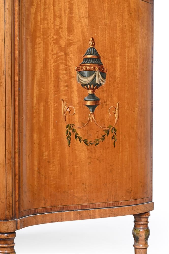 Y AN EDWARDIAN SERPENTINE FRONTED SATINWOOD SIDE CABINET, IN THE MANNER OF DRUCE & CO., CIRCA 1910 - 4