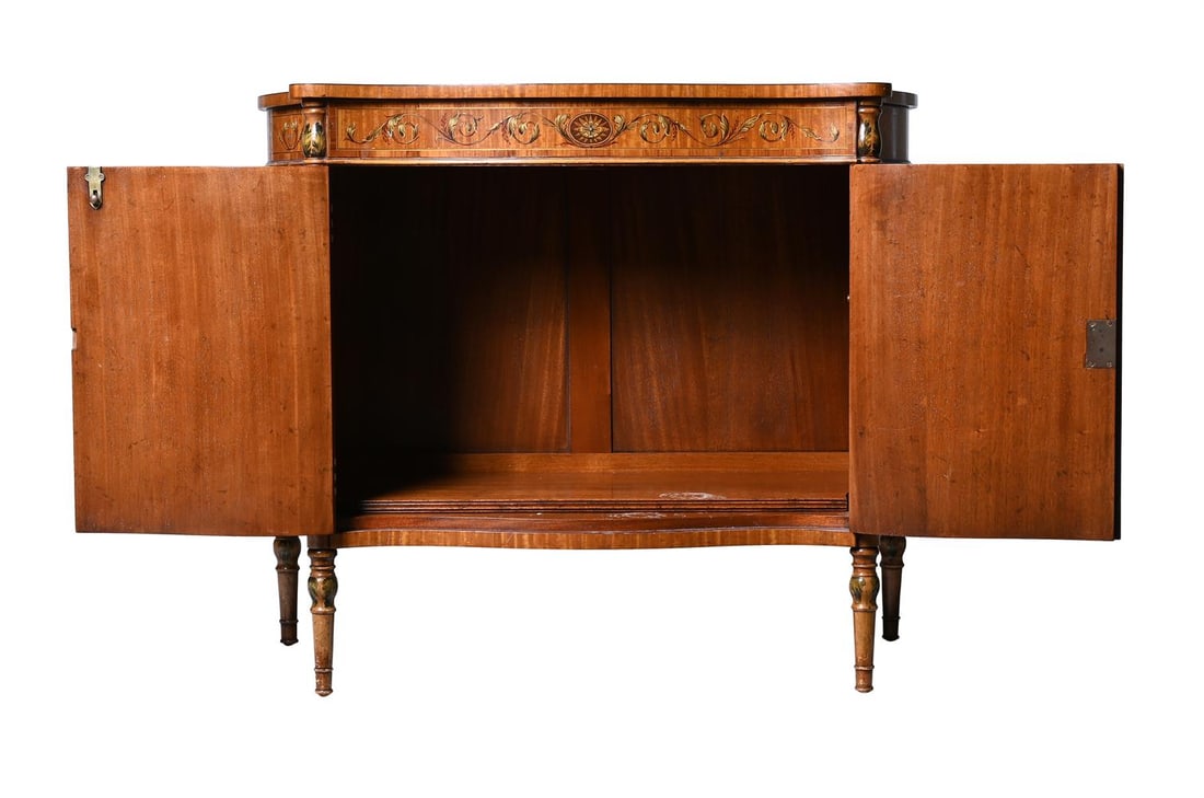 Y AN EDWARDIAN SERPENTINE FRONTED SATINWOOD SIDE CABINET, IN THE MANNER OF DRUCE & CO., CIRCA 1910 - 5