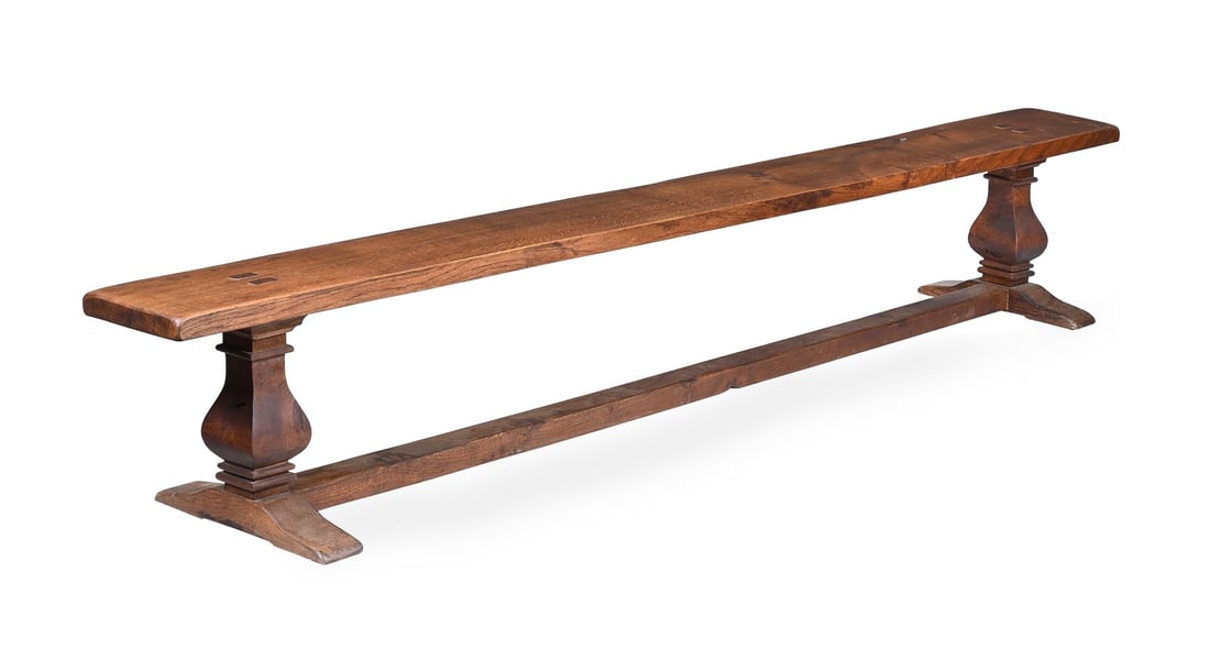 A SET OF FOUR LONG OAK REFECTORY FORMS OR BENCHES, CIRCA 1900 - 4