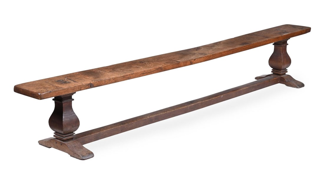 A SET OF FOUR LONG OAK REFECTORY FORMS OR BENCHES, CIRCA 1900 - 5