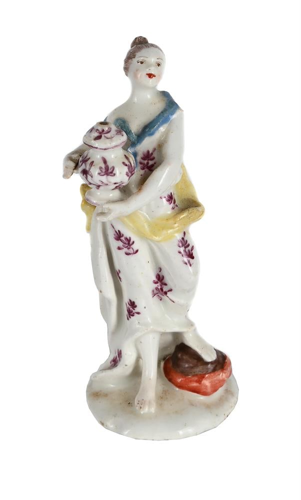 A BOW PORCELAIN MODEL OF A CLASSICAL WOMAN WITH AN URN AND COVER, MID 18TH CENTURY: A BOW PORCELAIN MODEL OF A CLASSICAL WOMAN WITH AN URN AND COVER, PROBABLY ANDROMACHE WITH THE ASHES OF HECTOR MID 18TH CENTURY 9.5cm high, 4cm at base Condition Report: 