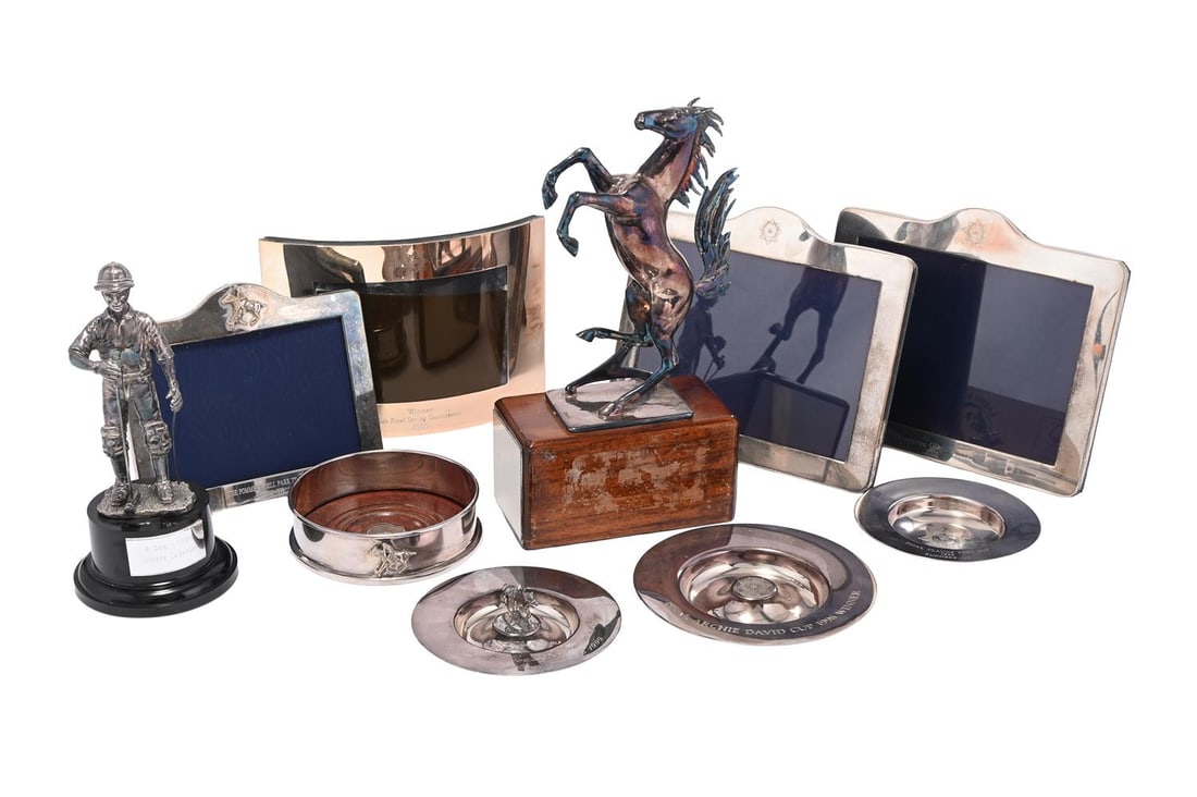 A SELECTION OF SILVER PLATED POLO RELATED ITEMS, MODERN: A SELECTION OF SILVER PLATED POLO RELATED ITEMS MODERN To include: four picture frames, three plate trophies, a polo player trophy, a prancing horse trophy, and a coaster the largest 28 x 15cm,