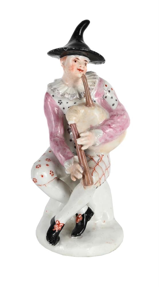 A BOW PORCELAIN MODEL OF A HARLEQUIN FROM THE COMMEDIA DELL'ARTE, CIRCA 1755: A BOW PORCELAIN MODEL OF A HARLEQUIN FROM THE COMMEDIA DELL'ARTE CIRCA 1755 Modelled seated playing the bagpipes and painted in coloured enamels 12.5cm high, 5cm at base 