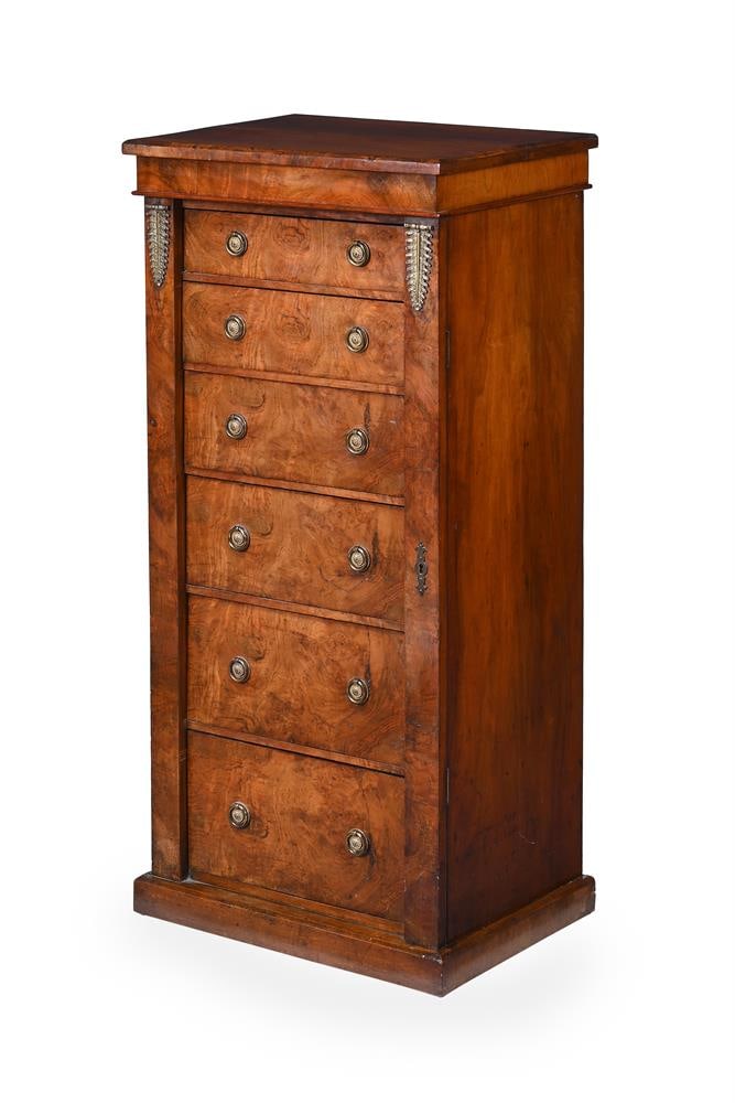 A LATE VICTORIAN FIGURED WALNUT AND GILT METAL MOUNTED PEDESTAL WELLINGTON CHEST, CIRCA 1890: A LATE VICTORIAN FIGURED WALNUT AND GILT METAL MOUNTED PEDESTAL WELLINGTON CHEST