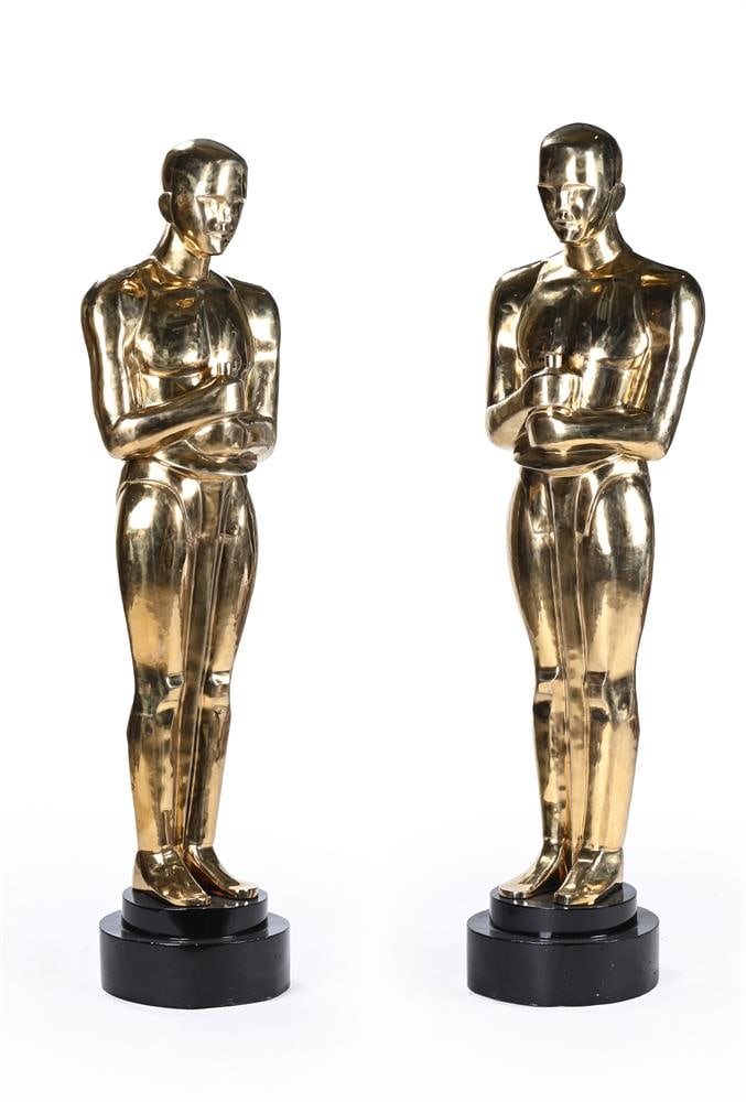 AFTER CEDRIC GIBBONS; A LARGE PAIR OF GILT BRASS FLOOR STANDING 'OSCAR' STATUES, CONTEMPORARY: AFTER CEDRIC GIBBONS; A LARGE PAIR OF GILT BRASS FLOOR STANDING 'OSCAR' STATUES