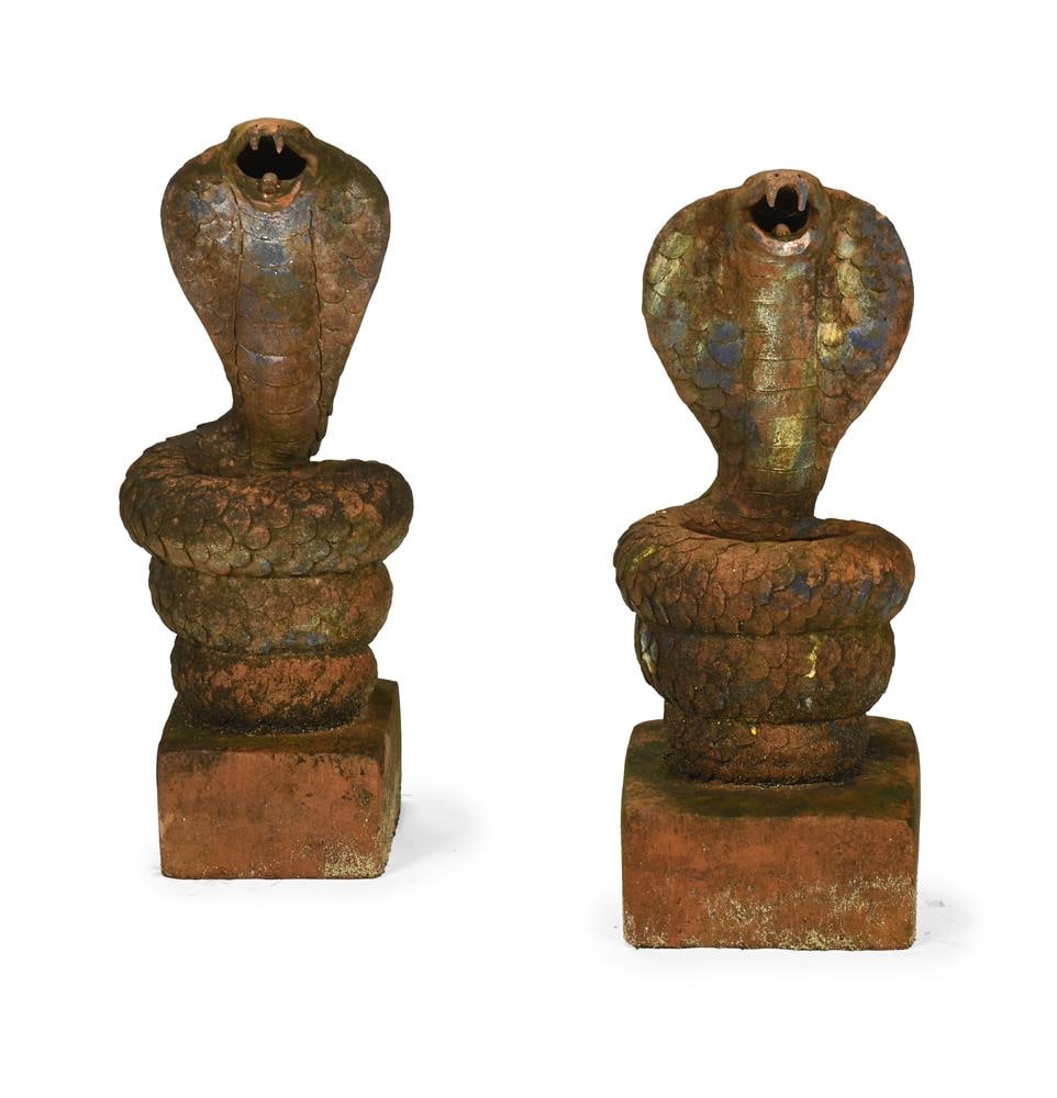 A PAIR OF TERRACOTTA COBRAS, 20TH CENTURY: A PAIR OF TERRACOTTA COBRAS 20TH CENTURY each 66cm high, 25 x 21cm at base Condition Report: PLEASE NOTE: ALL LOTS ARE LOCATED AT SACKVILLE WEST STORAGE IN ANDOVER