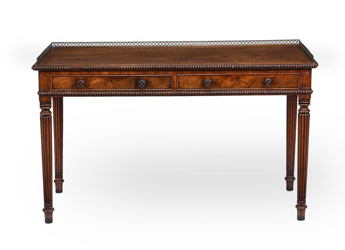 A GEORGE IV MAHOGANY DRESSING OR SIDE TABLE, IN THE MANNER OF GILLOWS, CIRCA 1825: A GEORGE IV MAHOGANY DRESSING OR SIDE TABLE IN THE MANNER OF GILLOWS, CIRCA 1825 With a pierced brass gallery 79cm high, 129cm wide, 52cm deep Condition Report: 