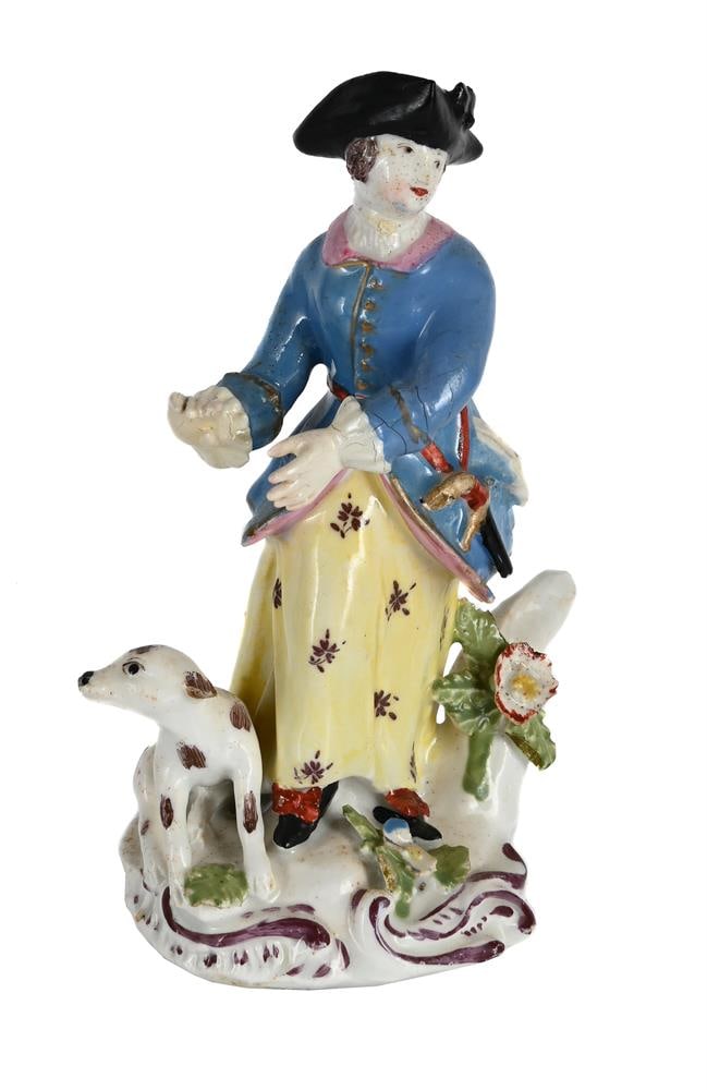 A BOW PORCELAIN MODEL OF A SPORTSWOMAN, MID 18TH CENTURY: A BOW PORCELAIN MODEL OF A SPORTSWOMAN MID 18TH CENTURY On scroll-moulded base with hound 13cm high, 6cm at base Condition Report: PLEASE NOTE: ALL LOTS ARE LOCATED AT SACKVILLE WEST
