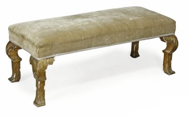 A carved and giltwood and velvet upholstered long