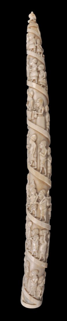 An African carved ivory elephant tusk , early 20th