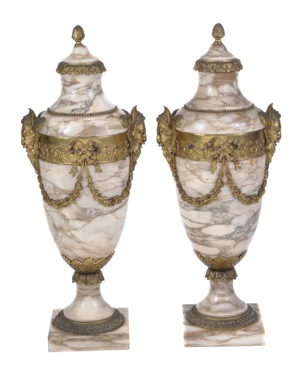 A pair of French gilt bronze and variegated cream