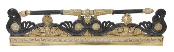 A Louis Philippe patinated and gilt brass fender,