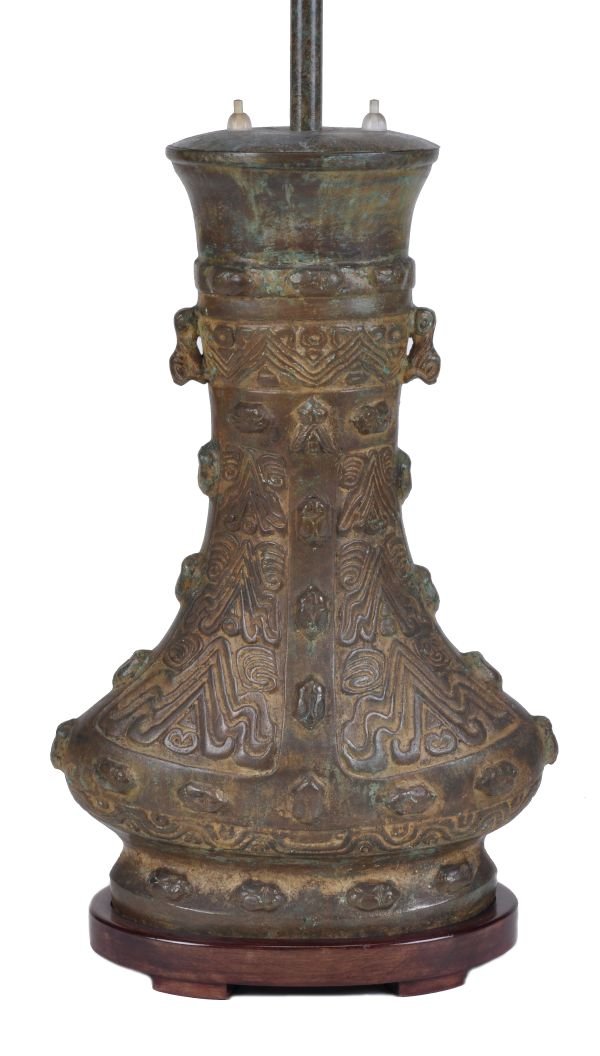 A Chinese bronze lamp base , 20th century, in arch