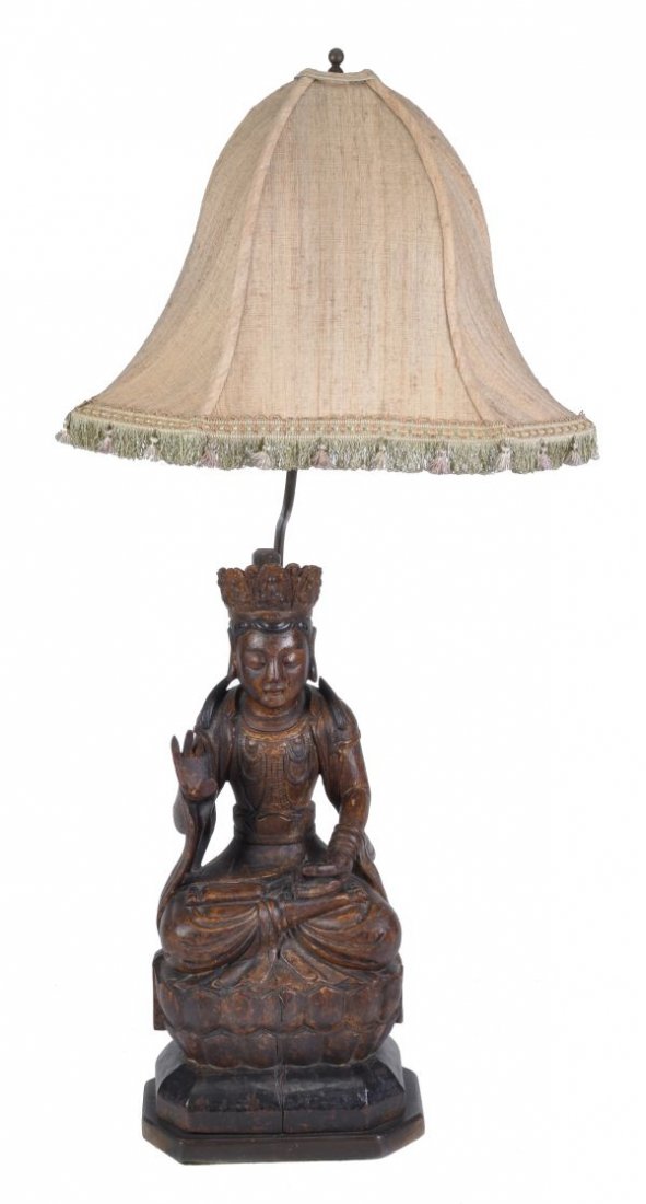 A Chinese carved wood figure of a deity , in Ming - 3
