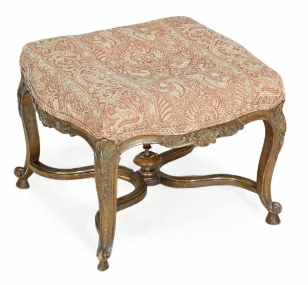 A French carved, stained walnut, parcel gilt and u