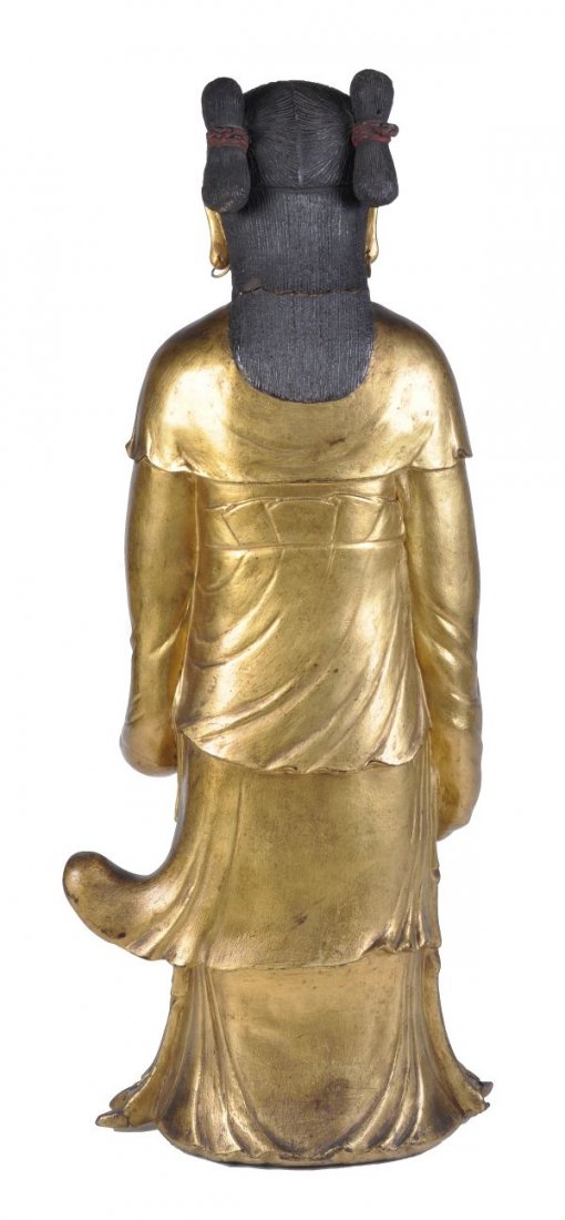 A South East Asian gilt wood figure of an attendan - 2