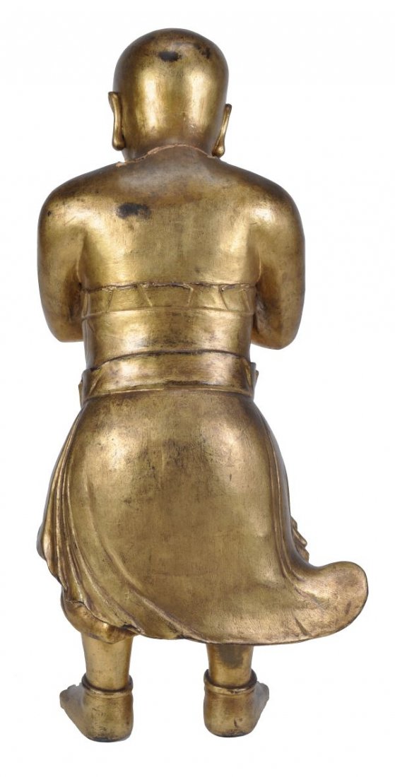 A South East Asian giltwood figure of a boy , late - 2