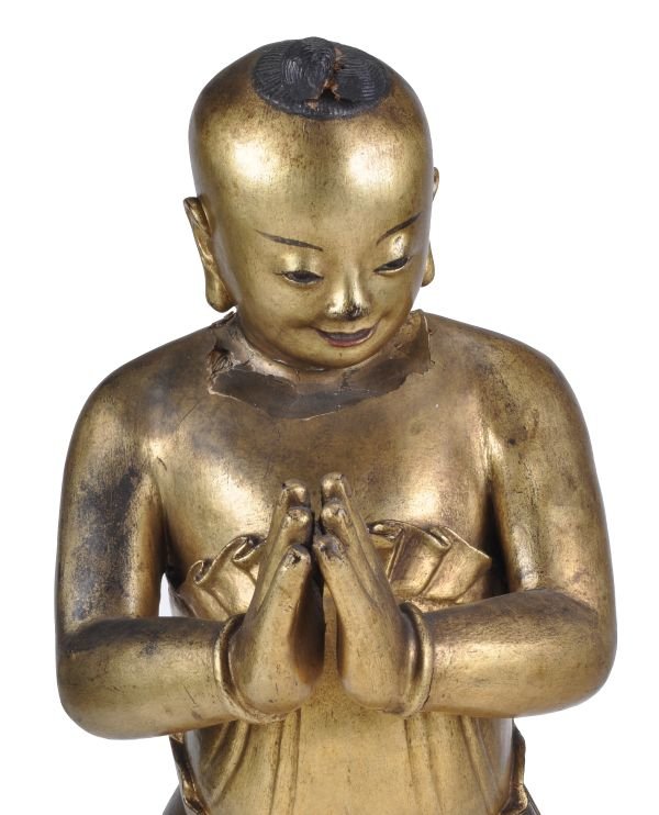 A South East Asian giltwood figure of a boy , late - 3