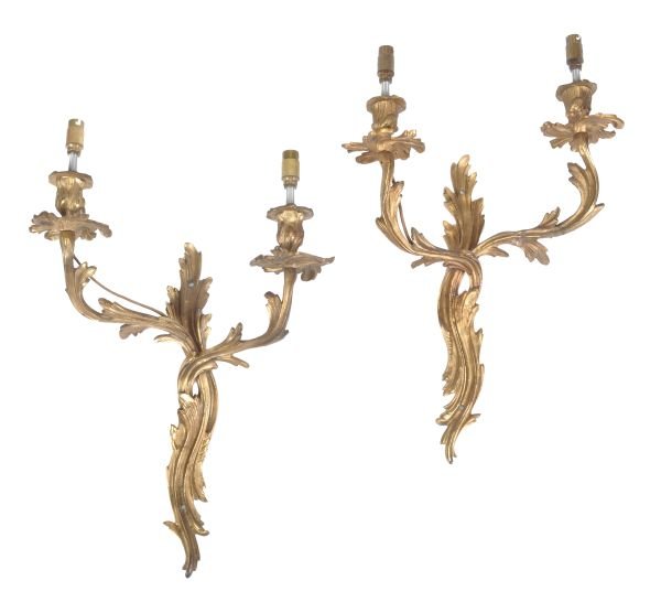 A pair of gilt metal twin light wall appliques, in