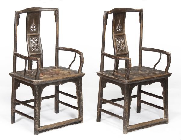 A pair of Chinese hardwood and lacquered chairs,